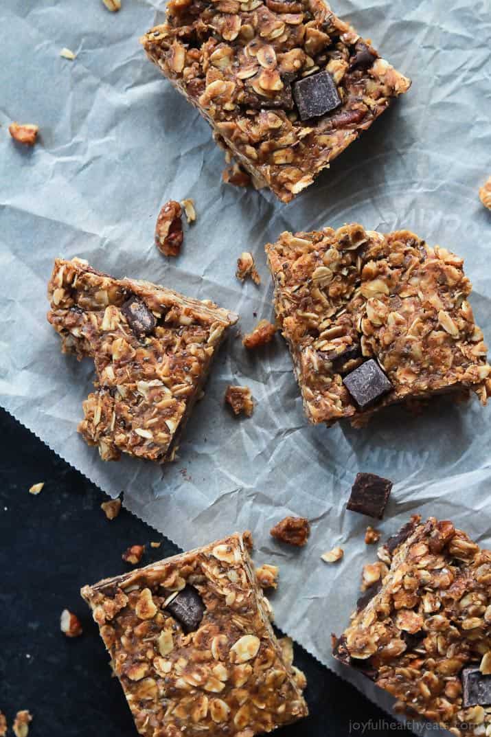 Breakfast never tasted so good with these No Bake Peanut Butter Chocolate Bars, done in 5 minutes! Filled with chocolate chunks, creamy peanut butter, chia seeds, and loads of other nutrients to fill you up! | joyfulhealthyeats.com #recipes