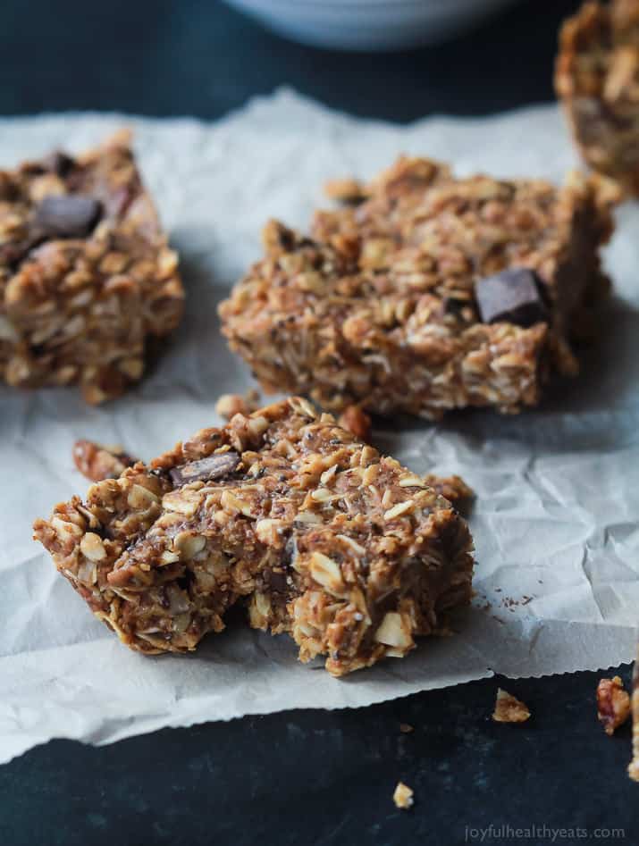 Breakfast never tasted so good with these No Bake Peanut Butter Chocolate Bars, done in 5 minutes! Filled with chocolate chunks, creamy peanut butter, chia seeds, and loads of other nutrients to fill you up! | joyfulhealthyeats.com #recipes