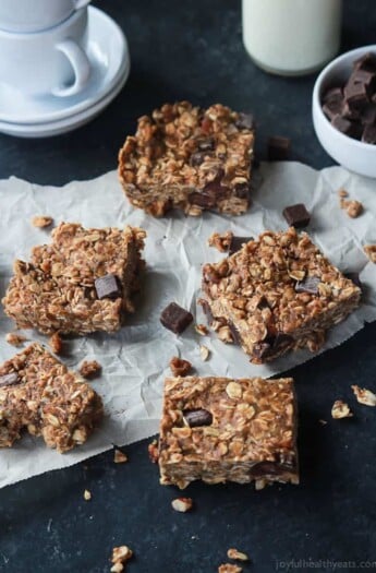 Pieces of No Bake Peanut Butter Chocolate Bars on parchment paper.