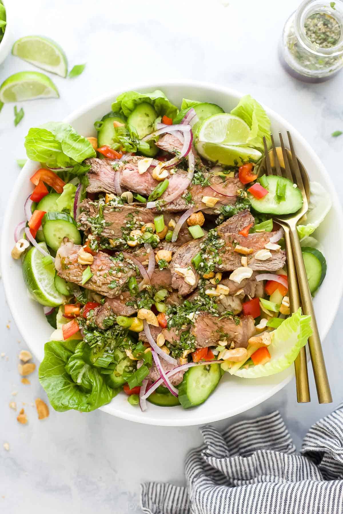 Bowl of Thai steak salad with sesame dressing.