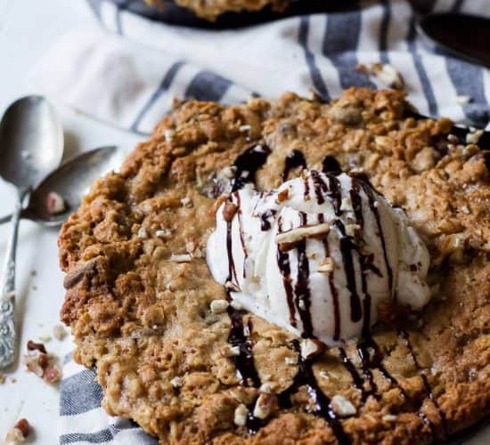 Chocolately, Gooey, and delicious Coconut Oatmeal Chocolate Chip Skillet Cookie made with a few secret ingredients to make this dish only 213 calories a serving! | joyfulhealthyeats.com Easy Healthy Recipes