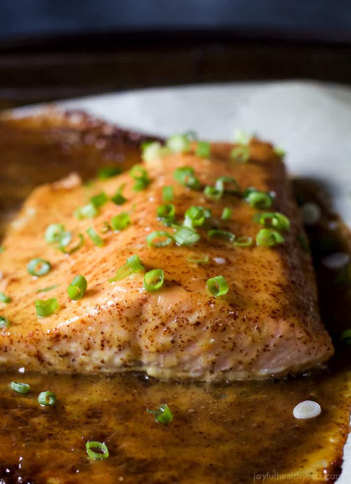 Close-up of Dijon Maple Glazed Salmon filet topped with scallions