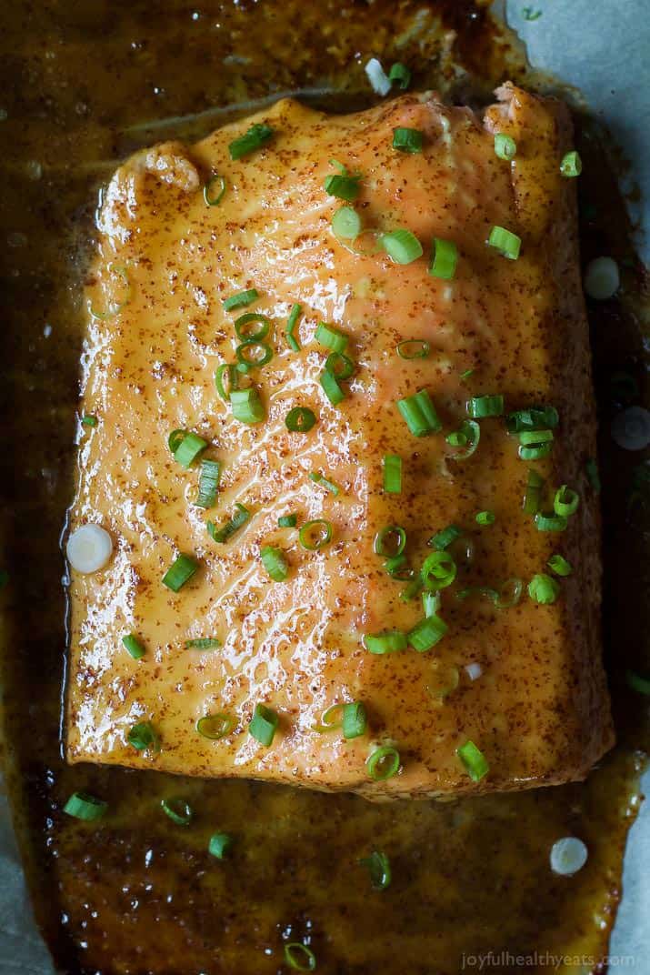 Top view of Dijon Maple Glazed Salmon fillet with scallions