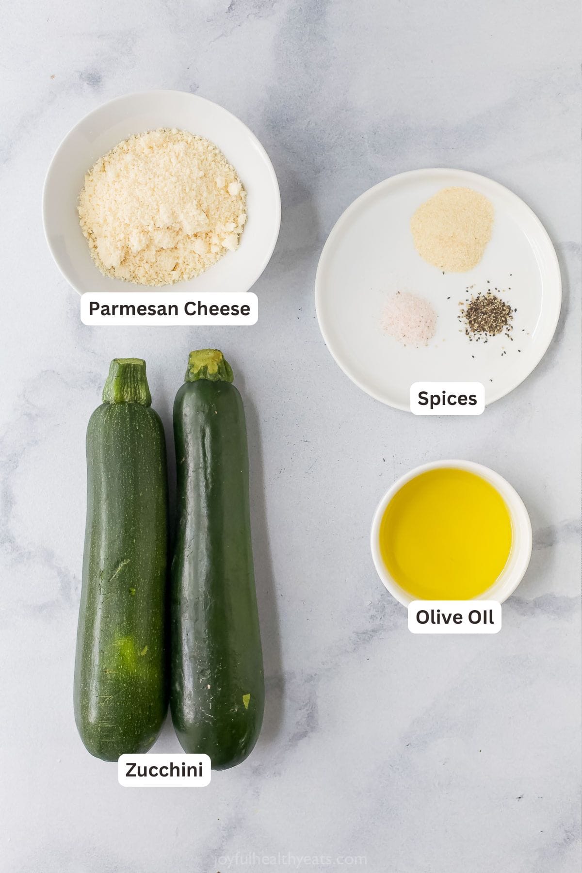 These quick and easy air fryer zucchini chips have a crispy texture and garlic Parmesan flavor that makes them totally irresistible! Overhead view of ingredients for air fryer zucchini chips