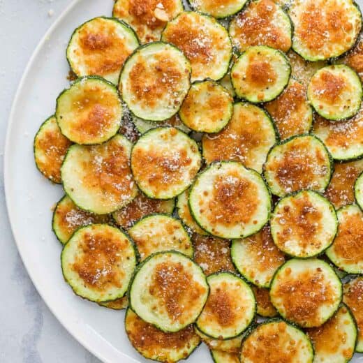 Overhead view of air fryer zucchini chips on plate