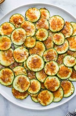 Overhead view of air fryer zucchini chips with Parmesan