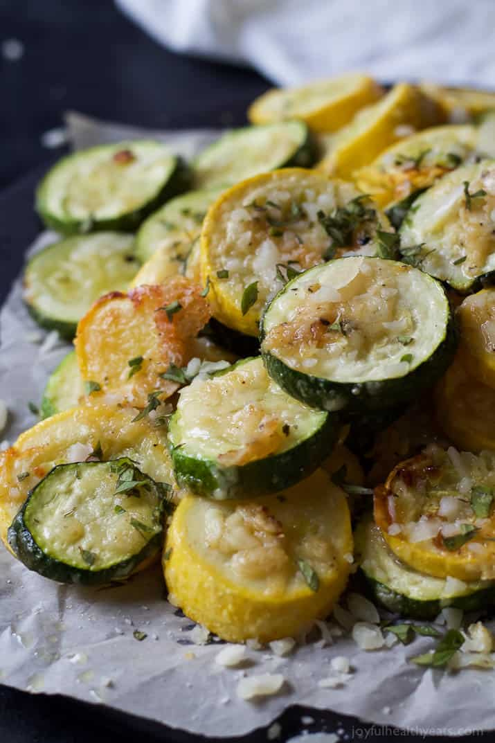 Close-up of Crispy Parmesan Garlic Zucchini Chips on parchment paper
