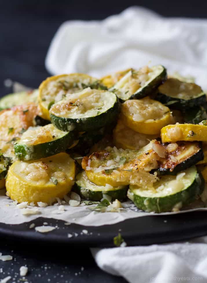 Close-up of Crispy Parmesan Garlic Zucchini Chips on parchment paper