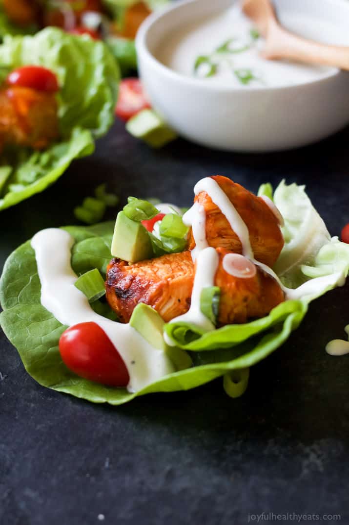 Grilled Buffalo Chicken Lettuce Wraps drizzled with creamy dressing