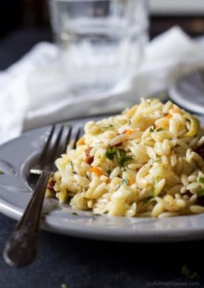 Mediterranean Orzo Salad filled with artichokes, sun-dried tomatoes, toasted almonds, and a white balsamic vinaigrette that will make you swoon! A great salad to serve with fresh seafood or grilled chicken. | joyfulhealthyeats.com #recipes