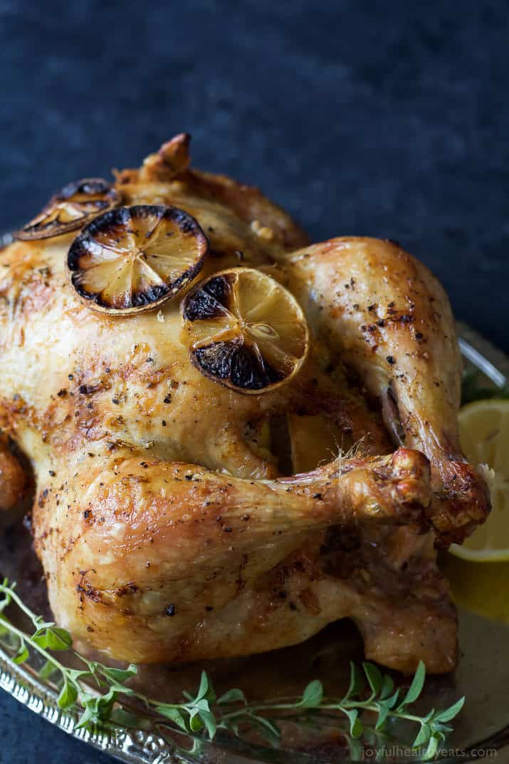 Forget grilled chicken! You'll love the crispy crust and smoky lemon garlic butter of this oven roasted chicken recipe for an easy, gluten-free, Paleo weeknight dinner the whole family will love!  | Happy and healthy yeats.com