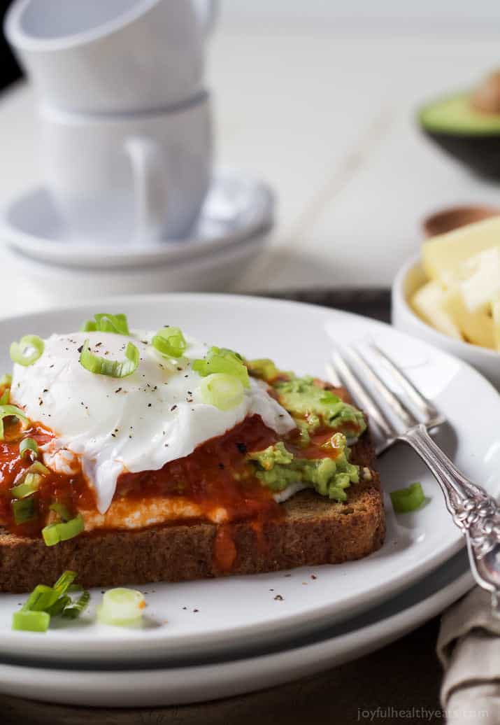 Ricotta Avocado Toast topped with Harissa and a Poached Egg, a heart healthy breakfast packed with protein and full of flavor for only 269 calories a serving! | joyfulhealthyeats.com #recipes