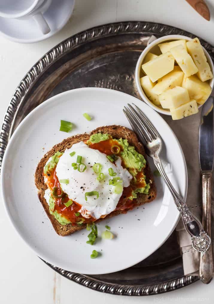 Ricotta Avocado Toast topped with Harissa and a Poached Egg, a heart healthy breakfast packed with protein and full of flavor for only 269 calories a serving! | joyfulhealthyeats.com #recipes