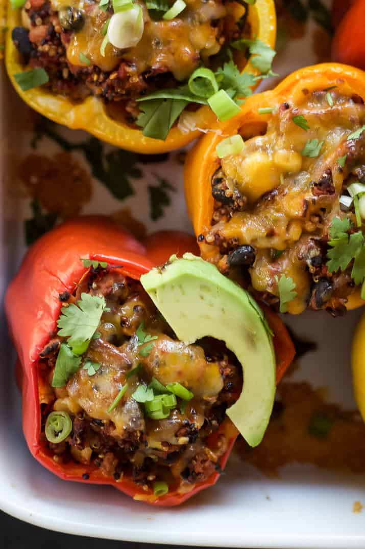 Southwestern Turkey Quinoa Stuffed Peppers filled with loads of protein and bold flavors that will leave you feeling satisfied and hungry for more all at the same time! Only 262 calories a serving! | joyfulhealthyeats.com #recipes