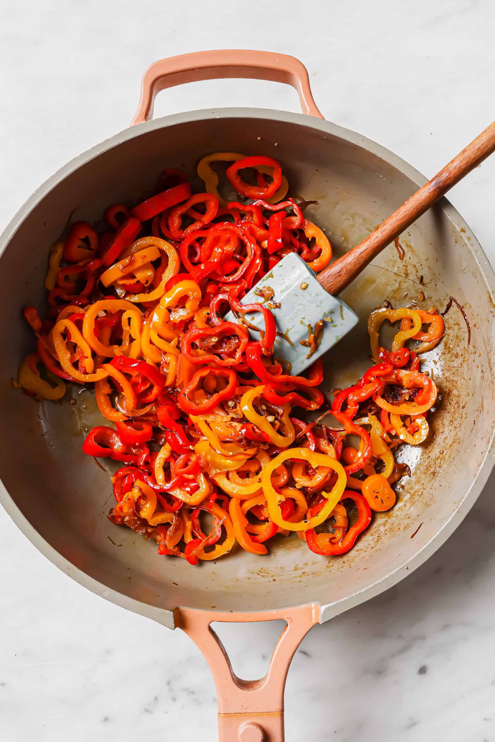 Cooking the bell peppers.