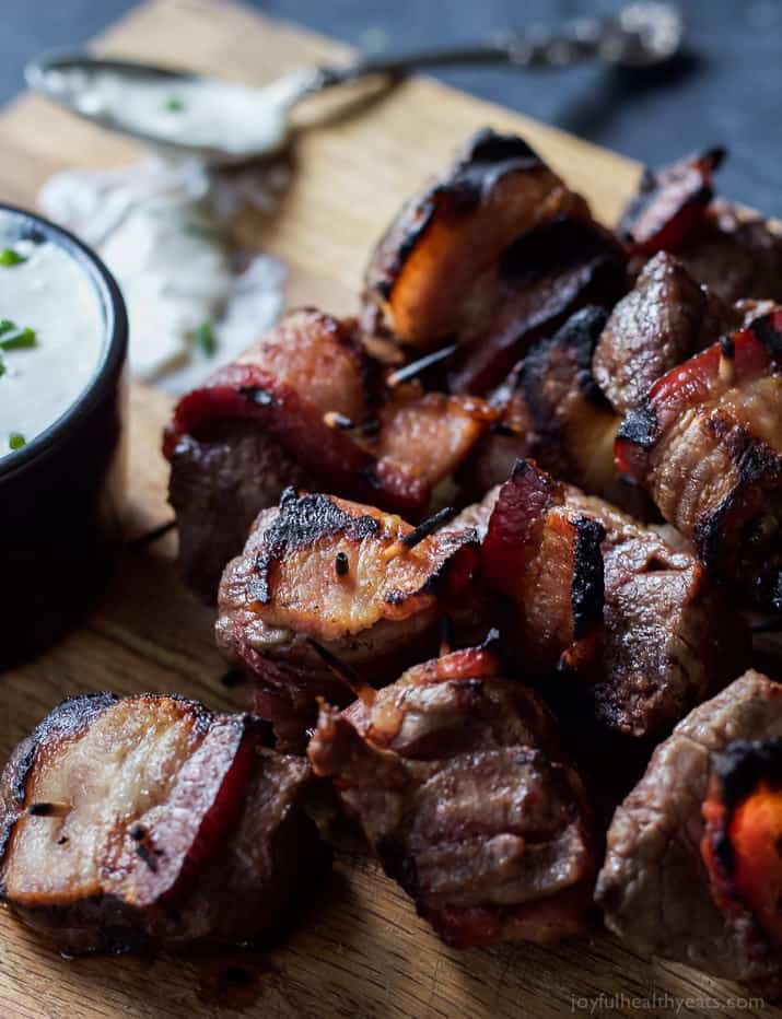 A game day appetizer you'll be fighting over! Tender Bacon Wrapped Tenderloin Bites chargrilled and served with a homemade creamy horseradish sauce! OMG! | joyfulhealthyeats.com #recipes #ad