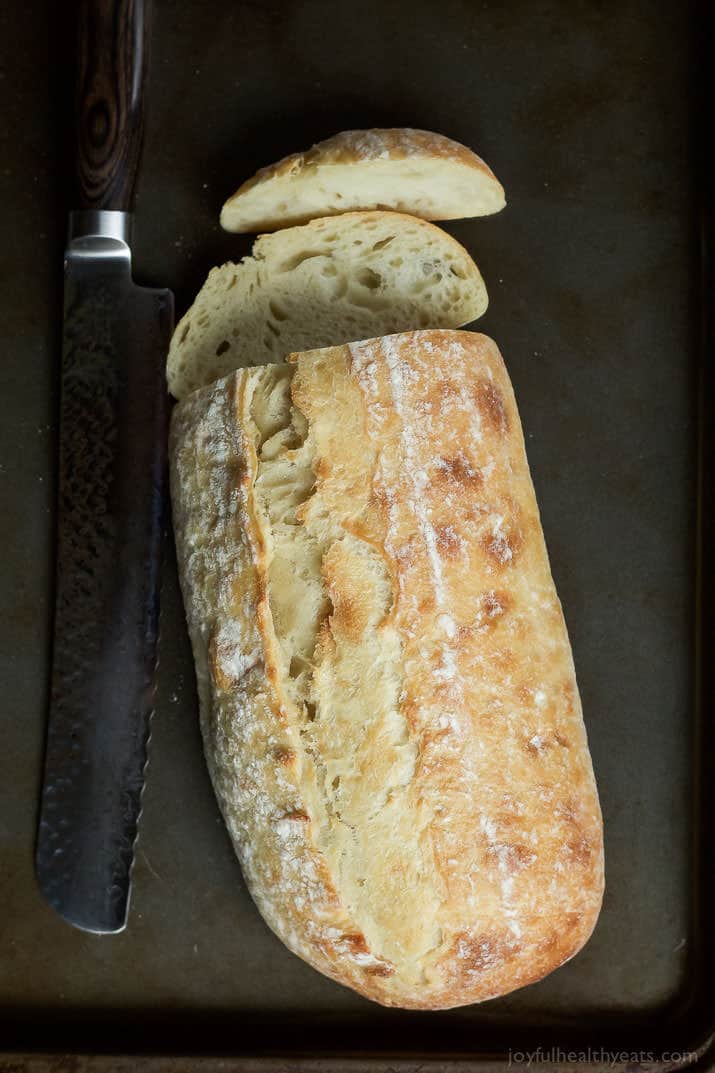 A Loaf of Italian Bread with Two Slices Cut Off