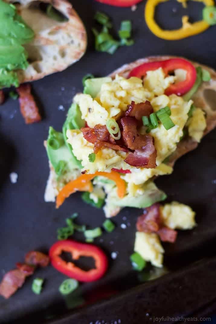 A Serving of Breakfast Bruschetta Bread on a Black Surface