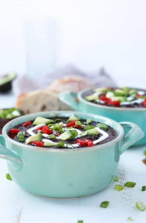 A gluten free Crock Pot Black Bean Soup with a smokey southwestern twist then topped with tangy greek yogurt for the ultimate savory bite. Believe me, you'll want to cozy up with a bowl of Black Bean Soup every night after trying this! | joyfulhealthyeats.com #vegetarian #recipes