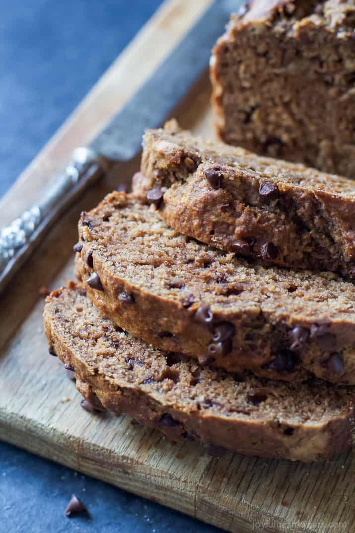 Slices of Double Chocolate Banana Bread on a wooden cutting board