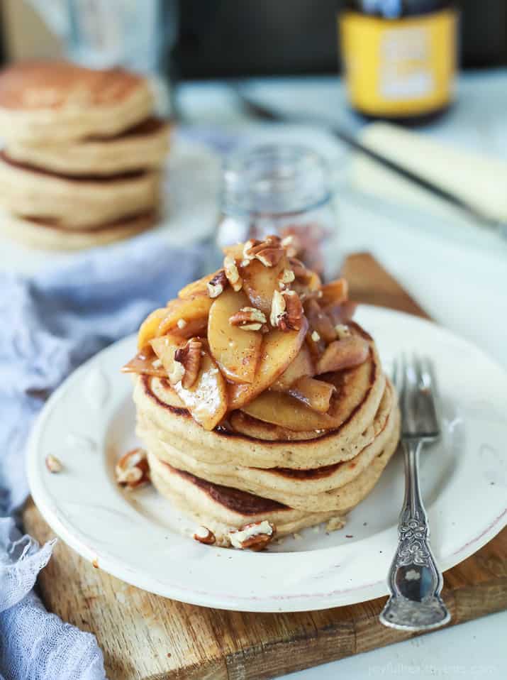 A stack of Fluffy Whole Wheat Pancakes topped with Cinnamon Apple Compote