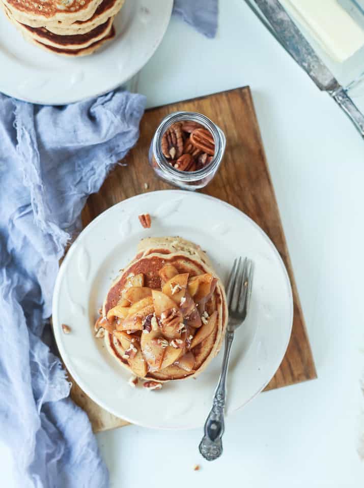 Top view of a stack of Fluffy Whole Wheat Pancakes topped with Cinnamon Apple Compote