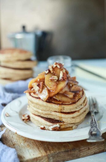 Fluffy Whole Wheat Pancakes made with a few secret ingredients, top with a Cinnamon Apple Compote that's made with honey instead of brown sugar for the grand finale! | joyfulhealthyeats.com