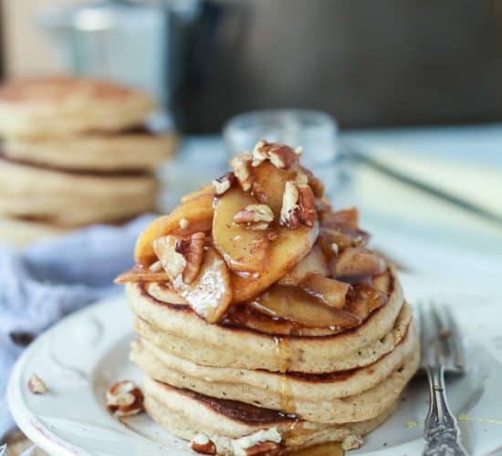 Fluffy Whole Wheat Pancakes made with a few secret ingredients, top with a Cinnamon Apple Compote that's made with honey instead of brown sugar for the grand finale! | joyfulhealthyeats.com
