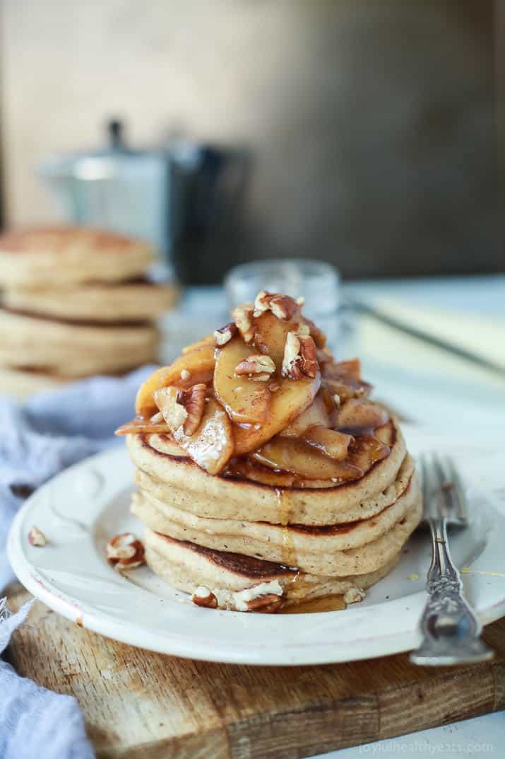 A stack of Fluffy Whole Wheat Pancakes topped with Cinnamon Apple Compote