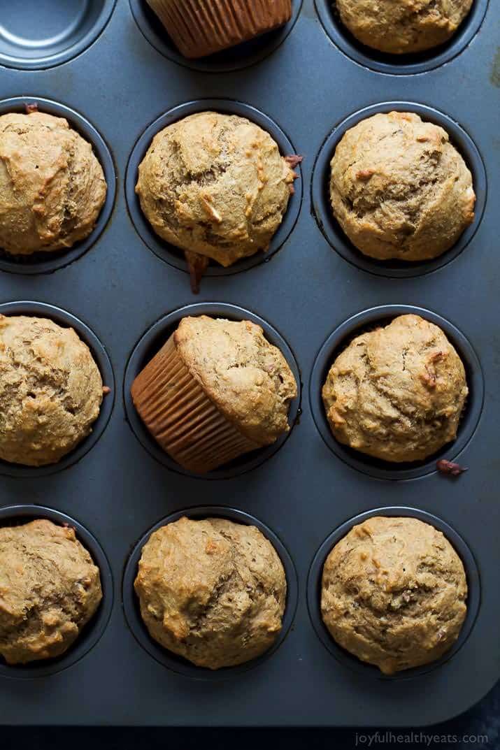 a muffin tray filled with banana nut muffins