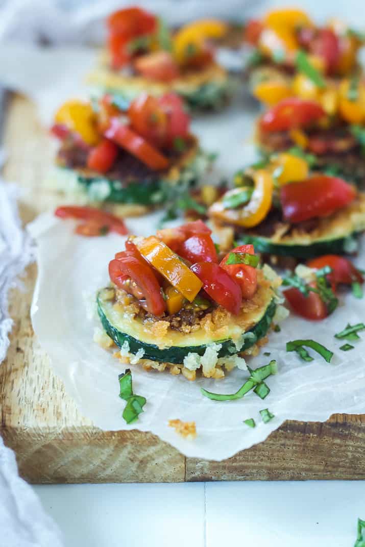 Skinny Bruschetta Zucchini Chips a low calorie, meat free, and dairy free, option for game day but still packs a punch of flavor from a few secret ingredients! This is a must try for sure! | joyfulhealthyeats.com #recipes #ad #MeatlessMondayNight