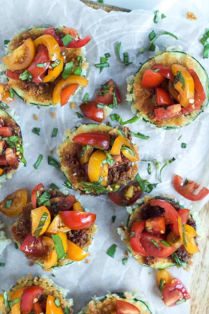 Skinny Bruschetta Zucchini Chips a low calorie, meat free, and dairy free, option for game day but still packs a punch of flavor from a few secret ingredients! This is a must try for sure! | joyfulhealthyeats.com #recipes #ad #MeatlessMondayNight