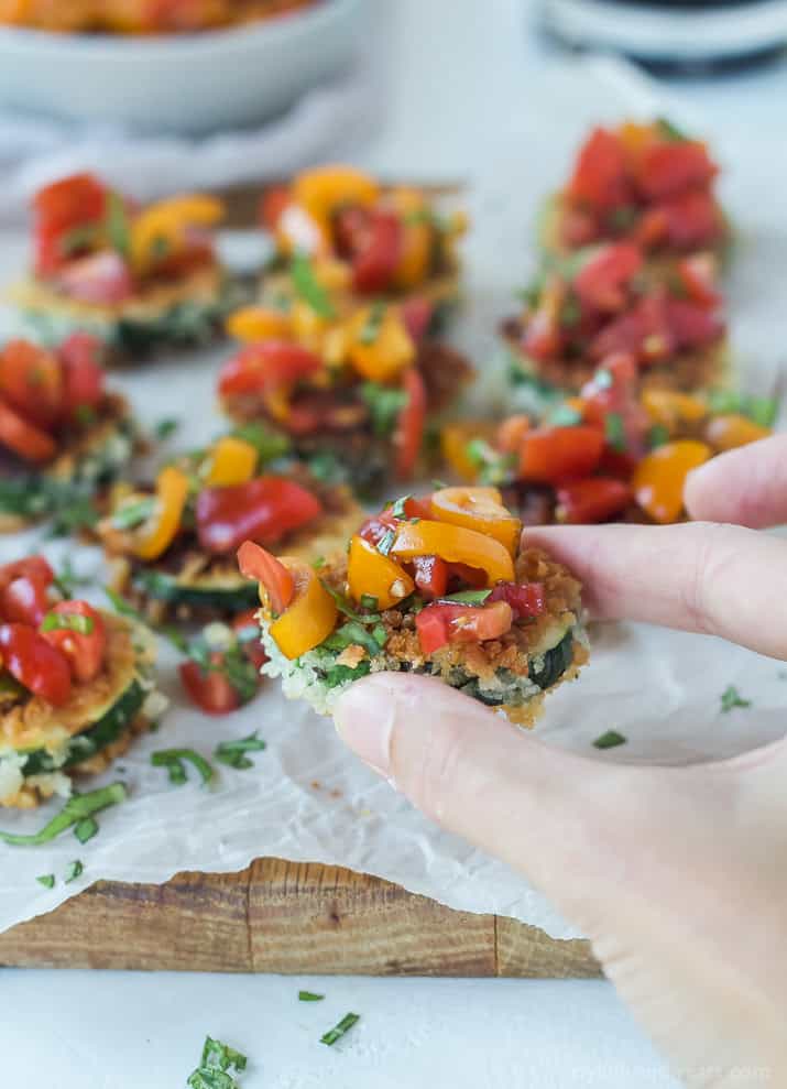 Skinny Bruschetta Zucchini Chips a low calorie, meat free, and dairy free, option for game day but still packs a punch of flavor from a few secret ingredients! This is a must try for sure! | joyfulhealthyeats.com #recipes #ad #MeatlessMondayNight