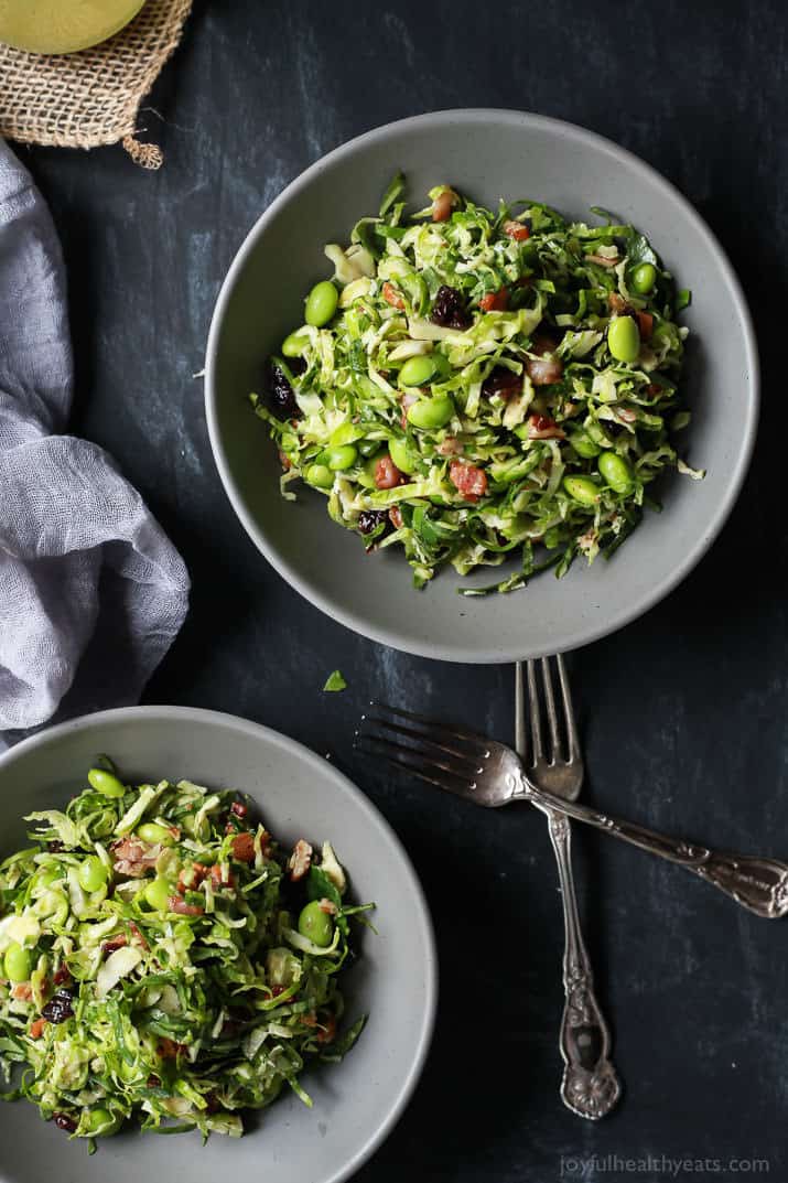 Autumn Kale & Shaved Brussel Sprout Salad in bowls