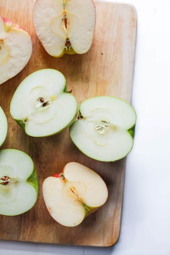 Apple halves on a cutting board