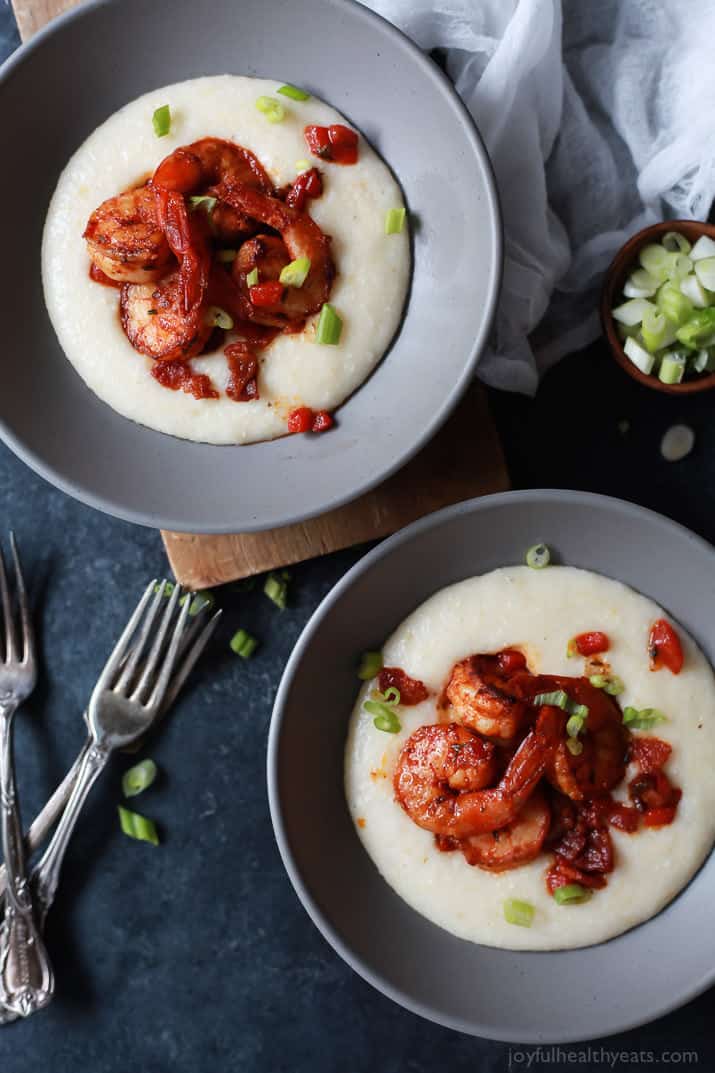 Top view of two bowls of Spicy Cajun Shrimp over creamy Smoked Gouda Grits