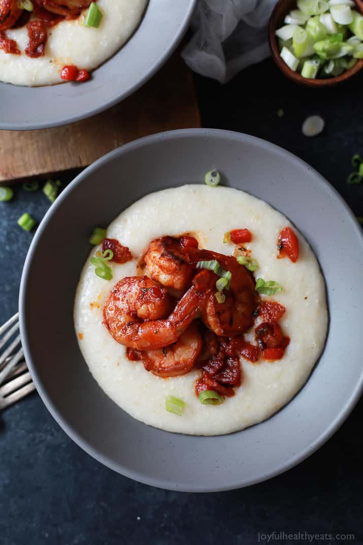 A bowl of Spicy Cajun Shrimp atop creamy Smoked Gouda Grits