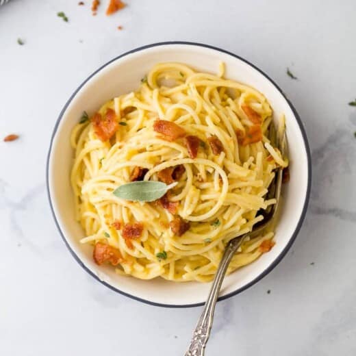 bowl of creamy butternut squash pasta with bacon