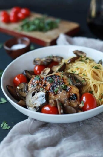 Easy Chicken Marsala cooked in butter and marsala wine then topped with Blistered Tomatoes. This dish is light, takes 30 minutes to make, is gluten free, under 350 calories, and is freakin tasty! | joyfulhealthyeats.com