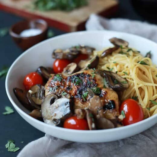 Easy Chicken Marsala cooked in butter and marsala wine then topped with Blistered Tomatoes. This dish is light, takes 30 minutes to make, is gluten free, under 350 calories, and is freakin tasty! | joyfulhealthyeats.com