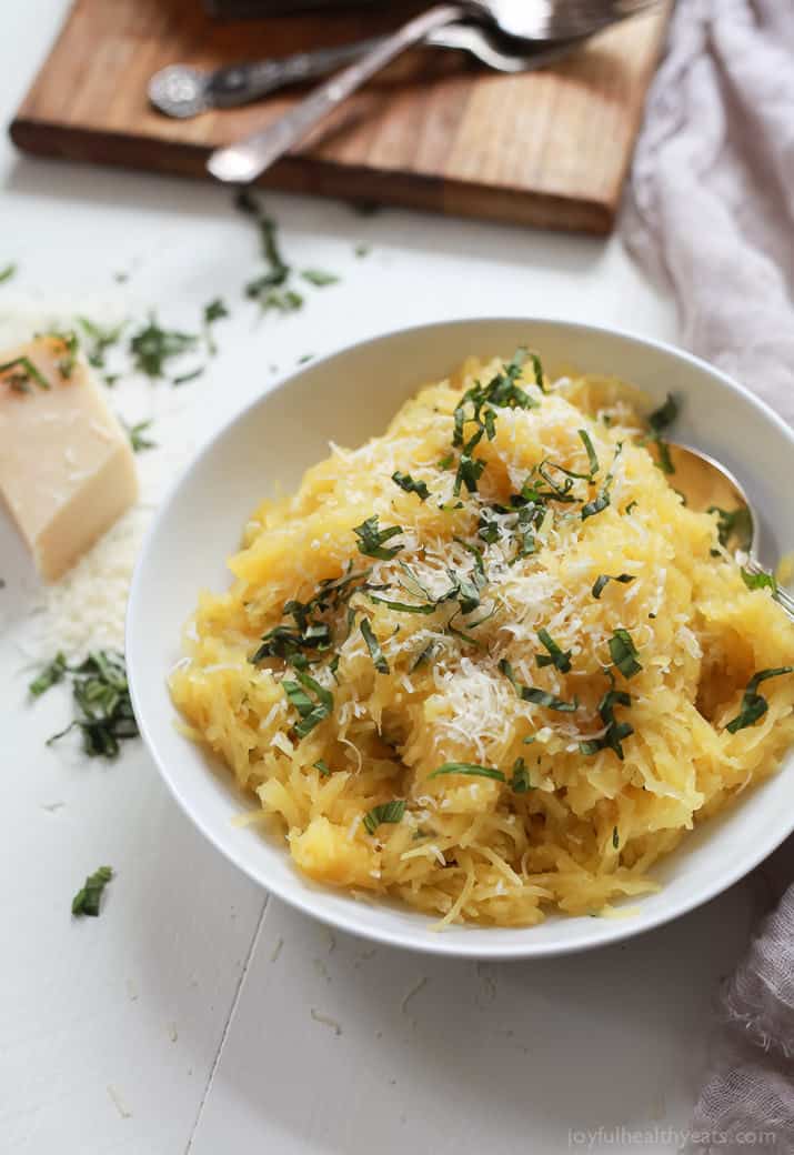 A 15 Minute way to make Spaghetti Squash that you will fall in love with, Parmesan Herb Microwave Spaghetti Squash. It's as easy as 1,2, ... and it needs to be on your table this holiday season! | joyfulhealthyeats.com 