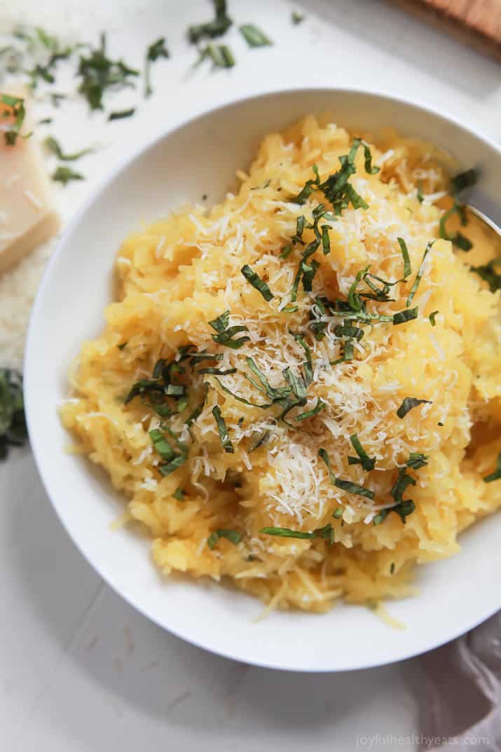 A 15 Minute way to make Spaghetti Squash that you will fall in love with, Parmesan Herb Microwave Spaghetti Squash. It's as easy as 1,2, ... and it needs to be on your table this holiday season! | joyfulhealthyeats.com 