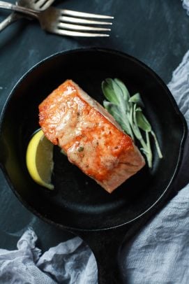 Salmon with Sage Brown Butter Sauce in a cast iron skillet