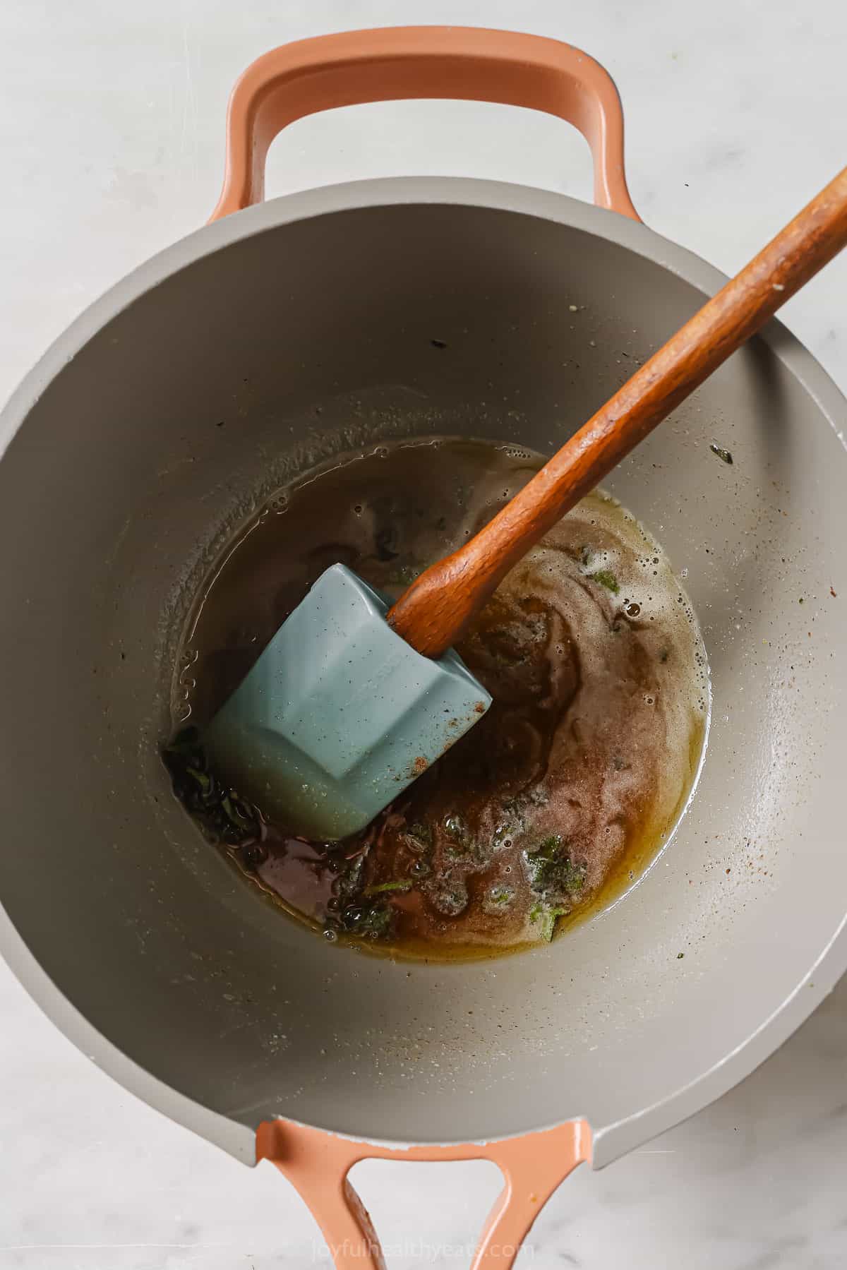 Adding the sage, honey, and nutmeg to the brown butter.