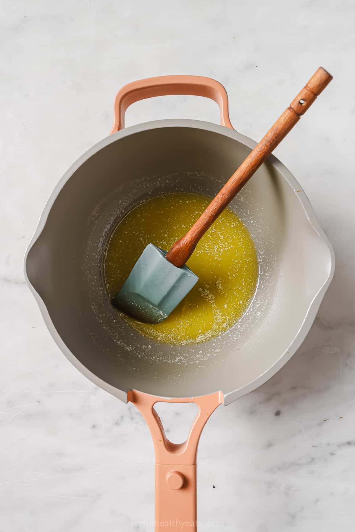 Melting the butter in the pan.