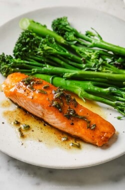 Pan seared salmon recipe with brown butter sauce and broccolini on the side.