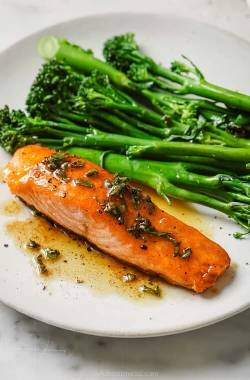 Pan seared salmon recipe with brown butter sauce and broccolini on the side.