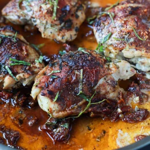 A bowl of Smoky Coconut Milk Braised Chicken Thighs.