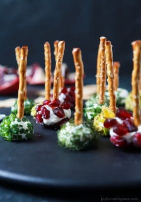 Everyone loves a good cheese ball, but your guest will fall in love with these Assorted Holiday Goat Cheese Balls coated with a combination of fresh dill, chives, pistachios, and pomegranate seeds! | joyfulhealthyeats.com #appetizer #ad #holiday