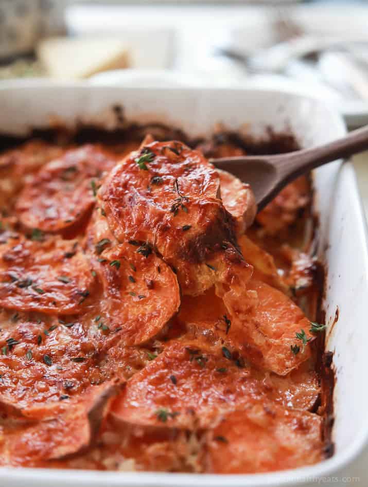 Cheesy Scalloped Sweet Potatoes in a baking dish.